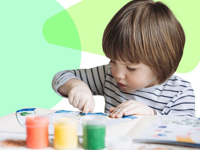 Child finger painting.