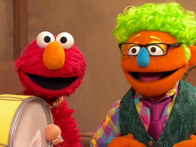 Elmo and a Muppet smile together