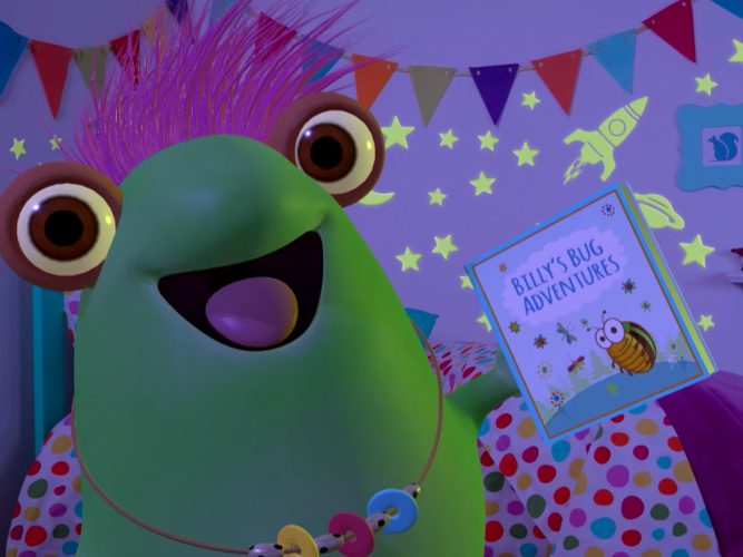 Marvie holding up a children's book