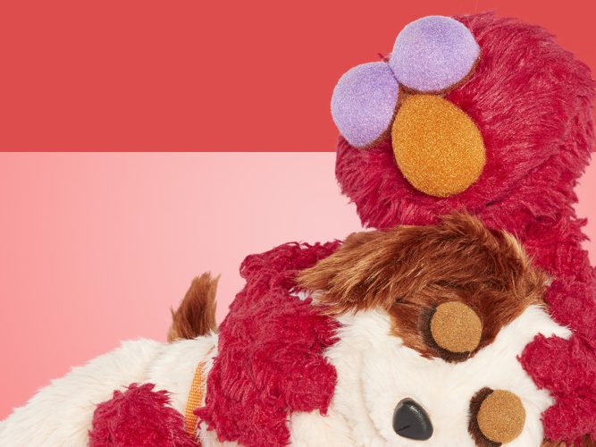 Elmo hugging Tango.