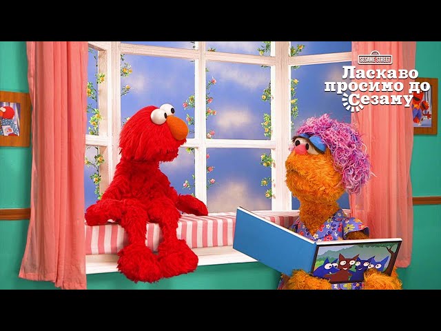 Elmo and his mom Mae reading.