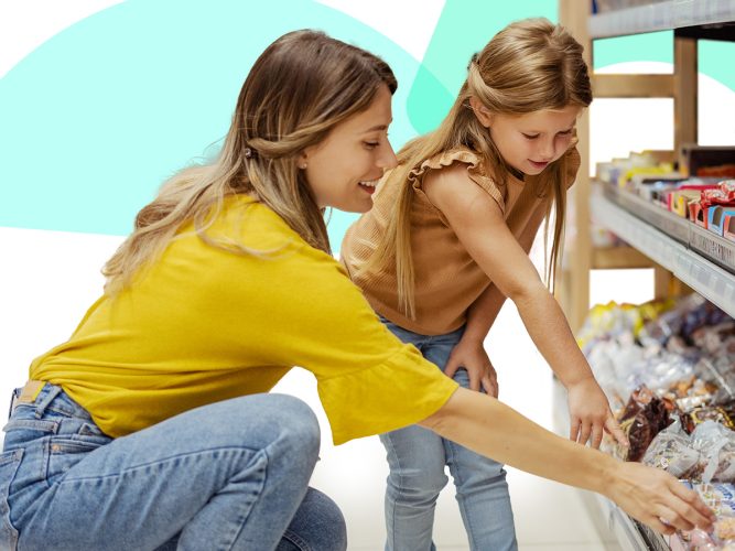 An adult and child picking out a snack at the grocery store.