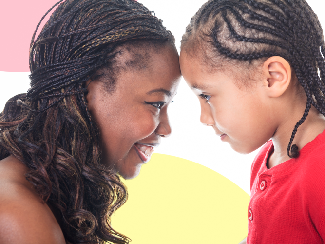 Parent and child smiling.