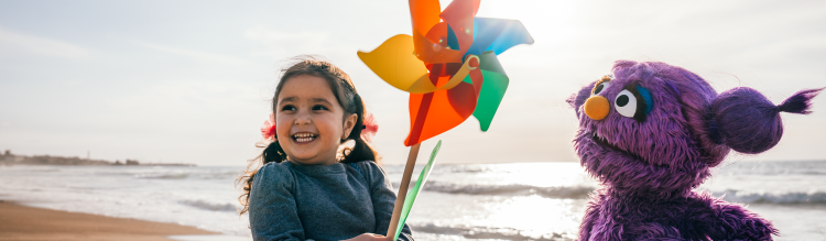 Basma and a child on the beach.