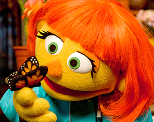 Julia with a butterfly on her hand.