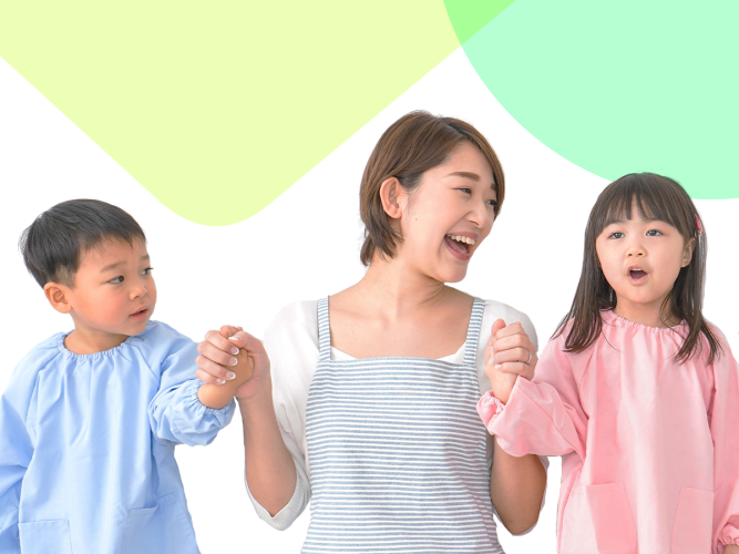 A parent holding hands with their two children.